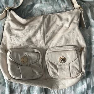 Michael Kors cream handbag.